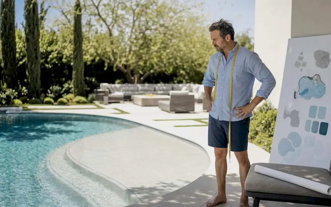 Pool designer inspecting zero entry pool slope