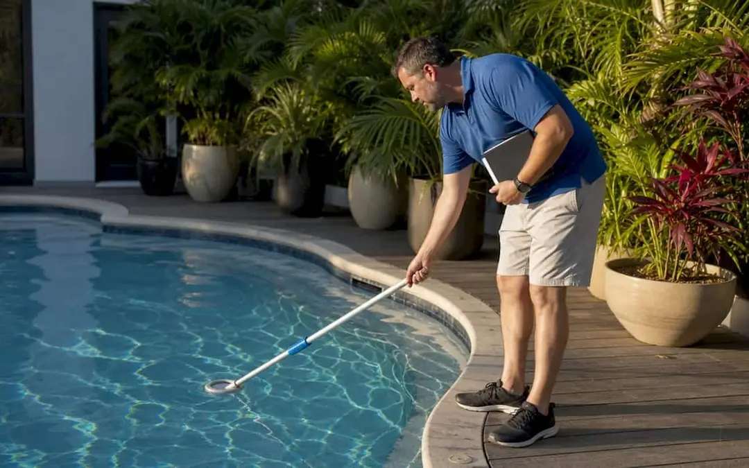 Man checking pool water level outdoors